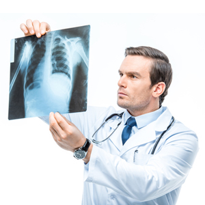 A doctor looks at an x-ray